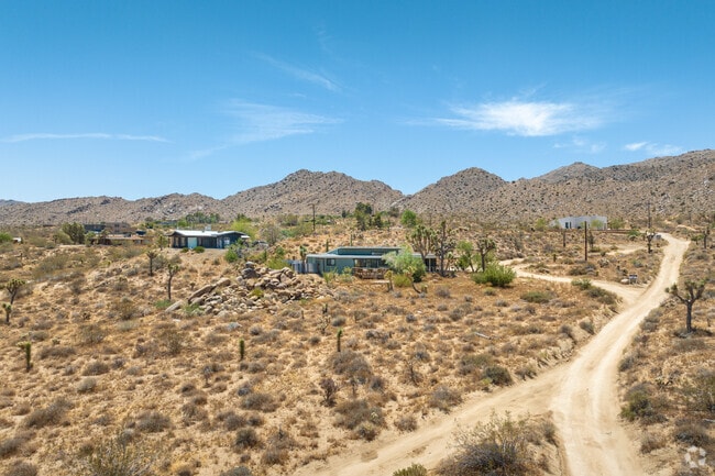 A group of beautiful desert homes sit near the entrance to Joshua Tree National Park.