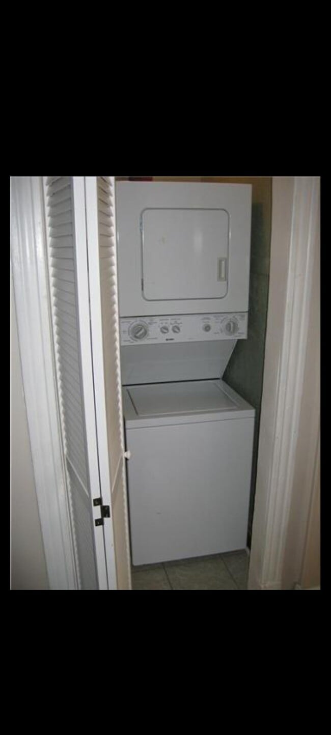 In unit laundry center included for tenant convenience