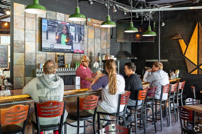 Grab some appetizers, taste a flight of different beers & listen to live music at Crane Brewing in Raytown.