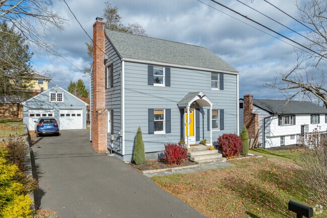 West Trumbull homes often feature detached garages and spacious driveways.