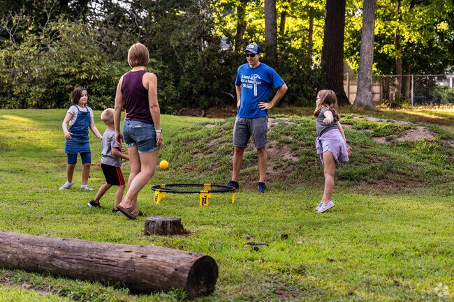 Families enjoy games together at Rollins Park in South End.