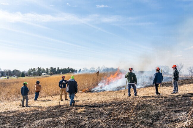 A large crew stays vigilant during a controlled burn at the Whitewater Nature Preserve.