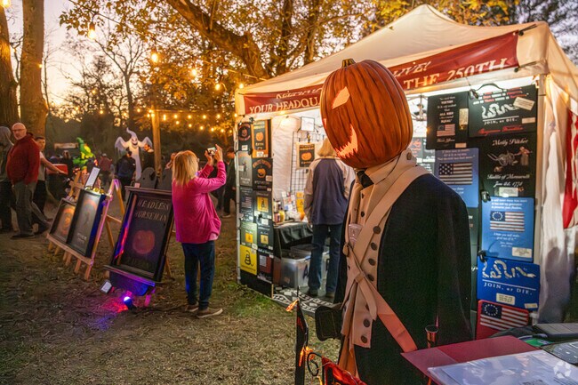 A spooky Revolutionary War Jack-o-lantern watches over the crowd at The Great Pumpkin Carve.