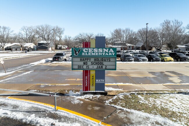 There is a sign for Cessna Elementary School near the main road.