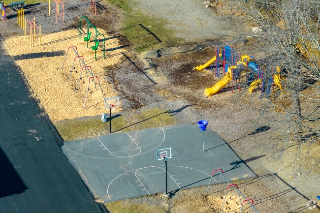 The basketball court and playground at John P. Oldham Elementary School in Norwood, MA.