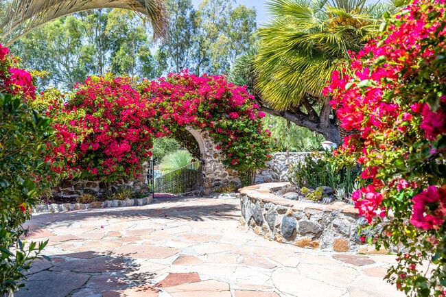 Leo Carrillo Park flower tunnel leads into the walkway area in Carlsbad, California