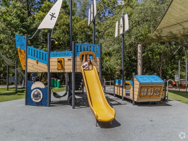Kids have loads of fun on this whimsical slide at Huffman Boulevard Park.