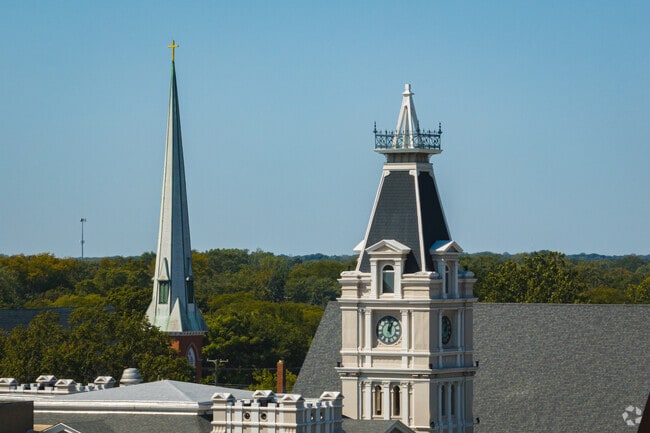 The Monroe County Courthouse stands high above with St. Michael the Archangel Church steeple.