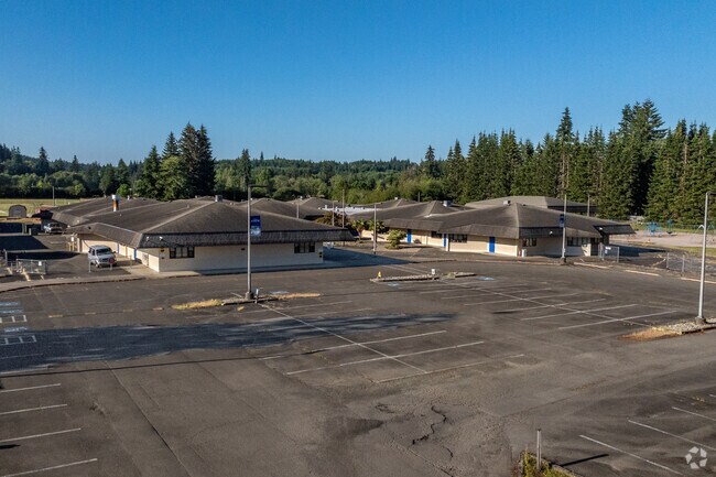 Elma Elementary sits surrounded by tall pine trees.