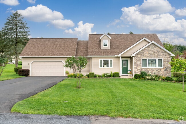 This ranch home with a pitched roof and garage shows simple living in Dallas.