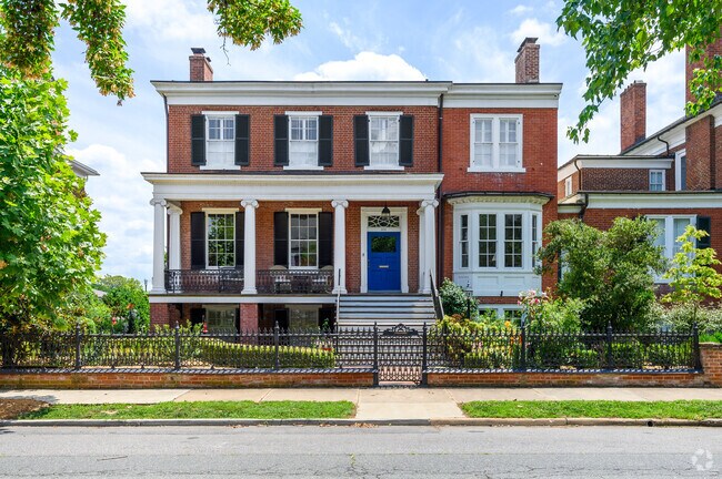 Homes are nestled amongst large oak trees in downtown Fredericksburg.