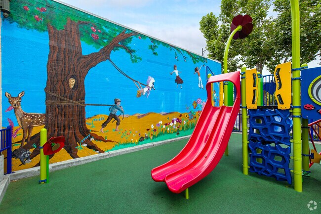 The J-Lot Playground features a mural and a slide.