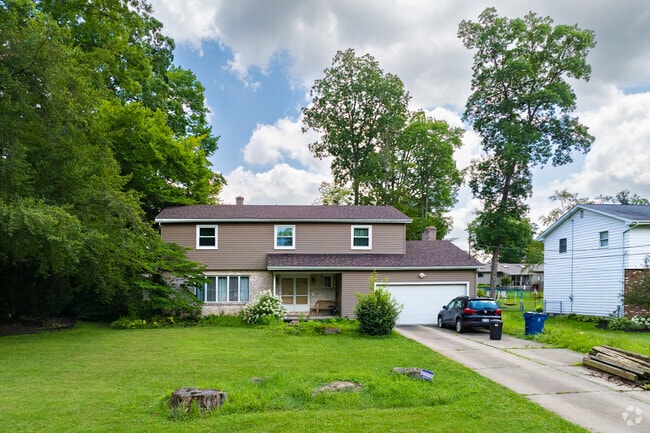 Find quiet neighborhood streets with driveways and garages in Champion Heights.