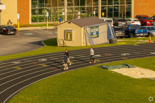 Students run the track at Litchfield CLC in Akron, Ohio.