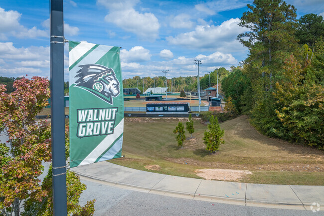 Close-up shot of school Banner in front of the athletic fields