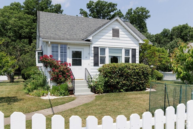 A lovely cottage style house sits behind a picket fence in Succasunna.