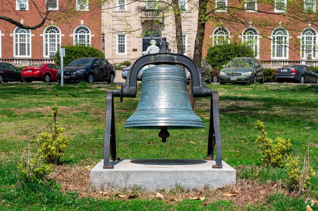 A large church bell sits outside the St. Josephs Seminary on Varnum St.
