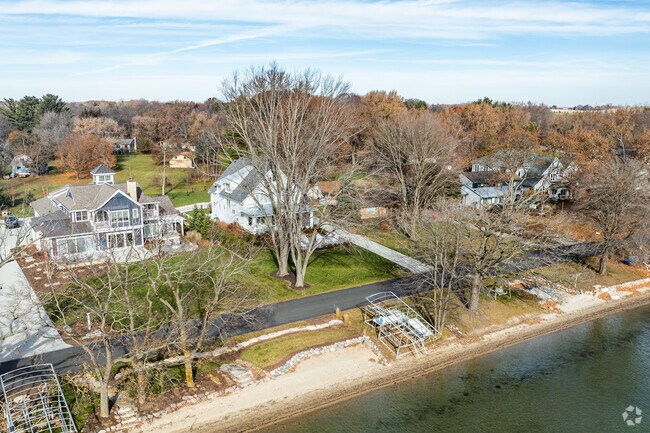 Housing styles of homes on Lac La Belle vary, but many have colonial or Craftsman influences.