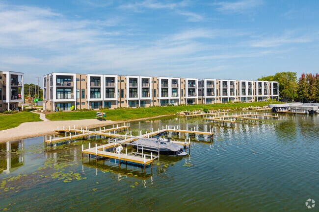 Modern townhouses sit on Lake Zurich's shores and include several docks for easy lake access.