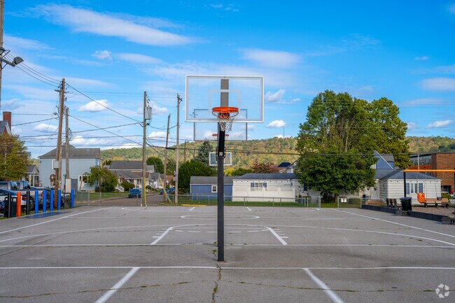 Shadyside locals enjoy fresh air and exercise at the basketball court.