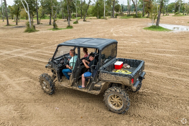 A family takes a joy ride at Xtreme Offroad Park, located just west of Crosby.