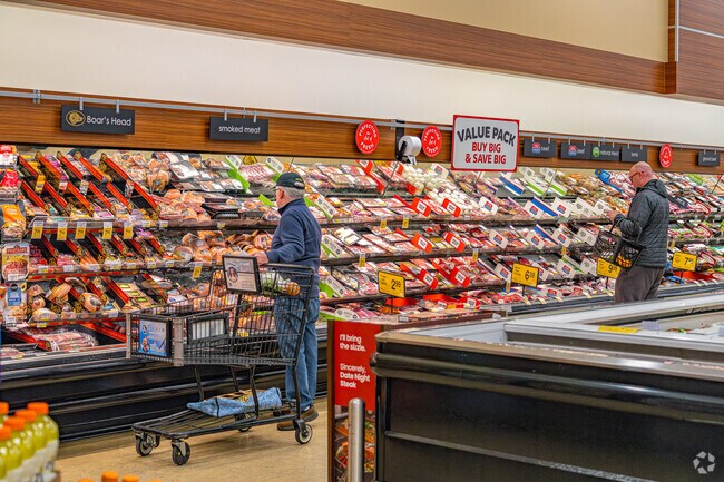 Men shop for meat at Safeway in Quail Glen.