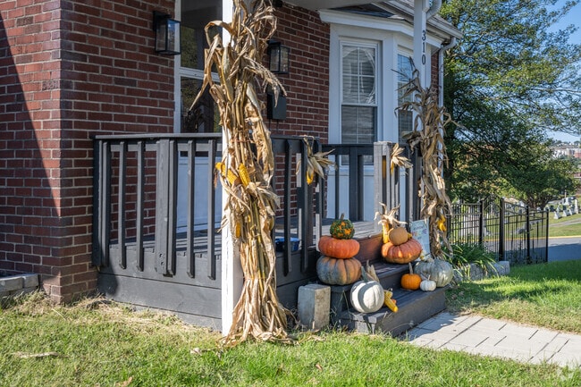 Pumpkins and corn stalks are used to decorate this home for the season in First Ward.