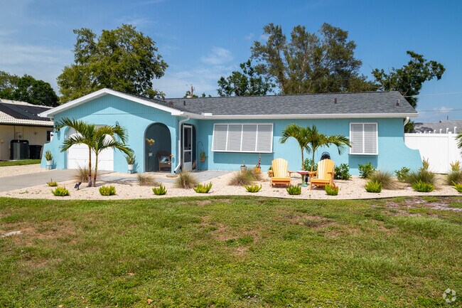 This renovated ranch home in Venice East has stylish yet minimalistic landscaping in the front.