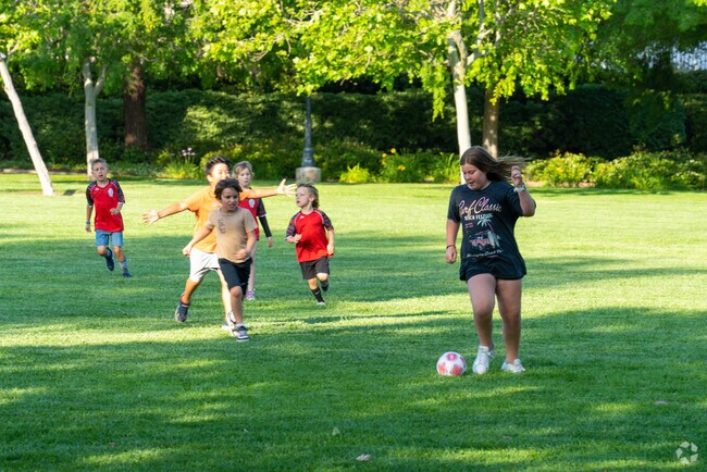 Kids enjoy a friendly soccer match at Meadows Park in Paseo del Sol.