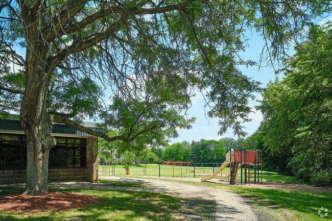 Around the back of Abbot Elementary is a larger play area with a baseball field and swings.