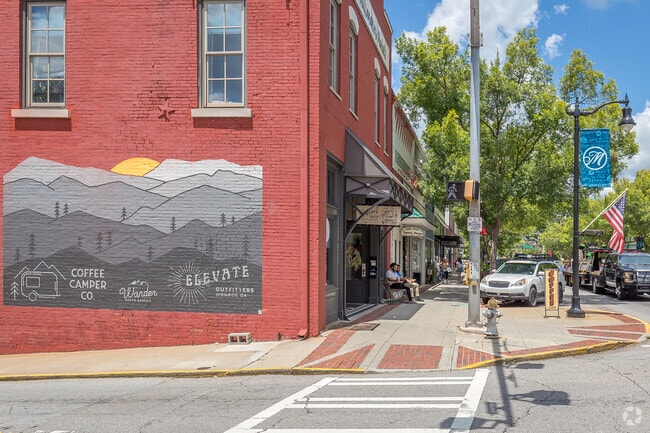 Tree lined streets offers shade to those in Monroe enjoying the downtown area.