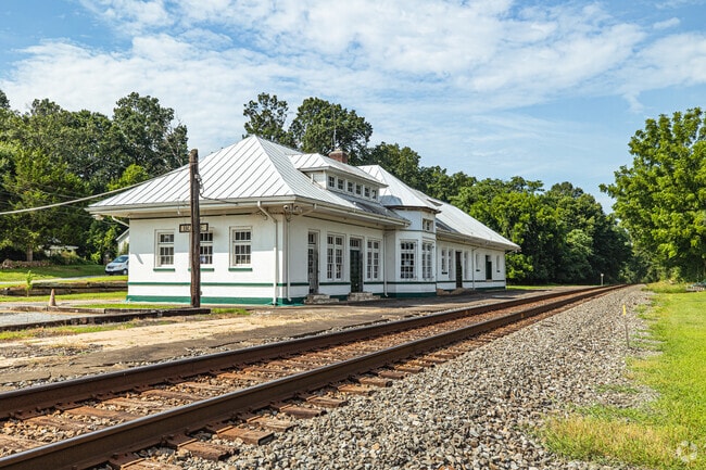 The historic Boyce railroad station stands beside active tracks, reflecting the town’s roots in 19th-century rail development.