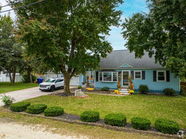 Mid-Century Cape Cod located in the quiet town of Hudson.