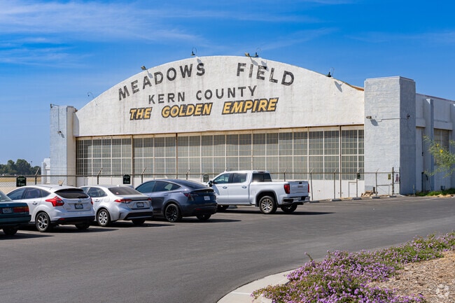 An old airplane hangar near Parkview Estates still displays its original Meadows Field sign.