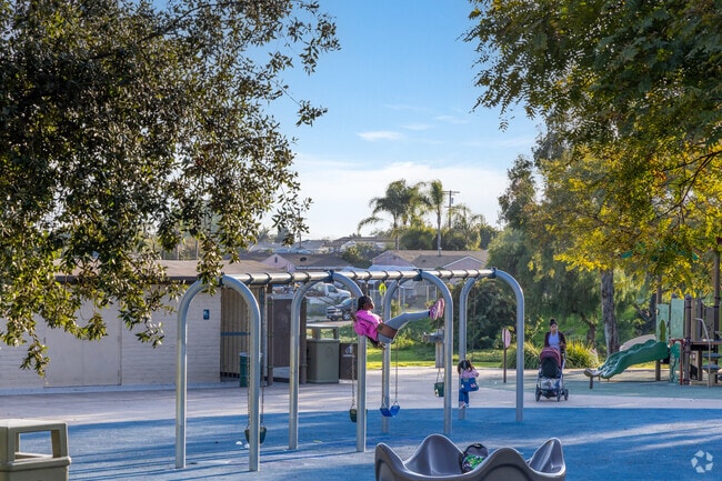 A child swings at Gompers Park near Ridgeview-Webster.