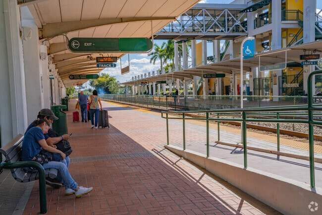 People Waiting For The Train at the Station in Pompano and Santa Barbara Shores Neigborhood.