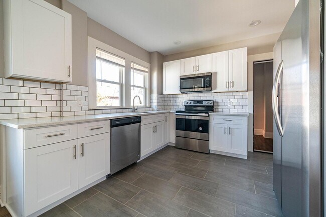 New shaker cabinets and stainless steel appliances.