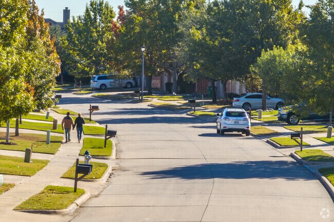 Couples take to the sidewalks to spend afternoons together in Woodcreek.