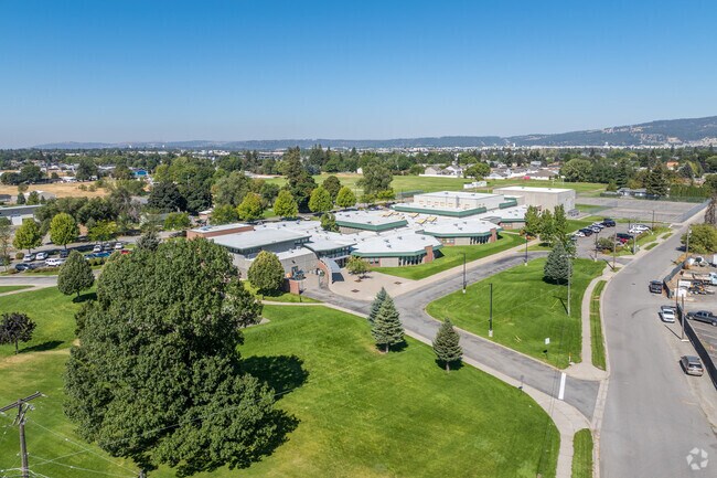 Greenacres Middle School features a large outdoor space behind the school.