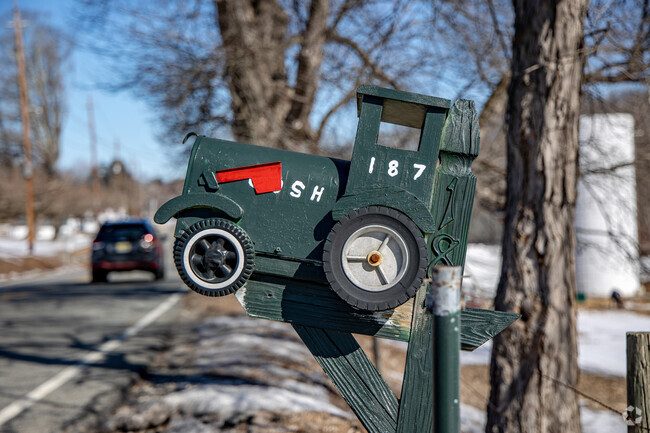 A tractor-shaped mailbox in Oak Ridge reflects the community’s appreciation for farming and rural life.