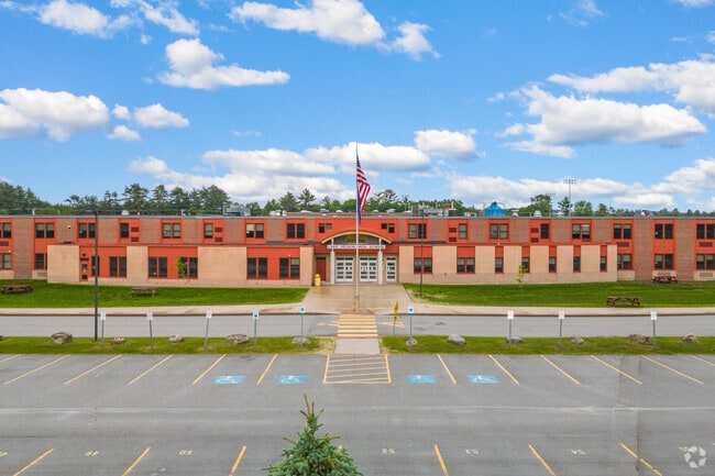View of entrance and flag flying proud at Lake Region High School in Bridgton.