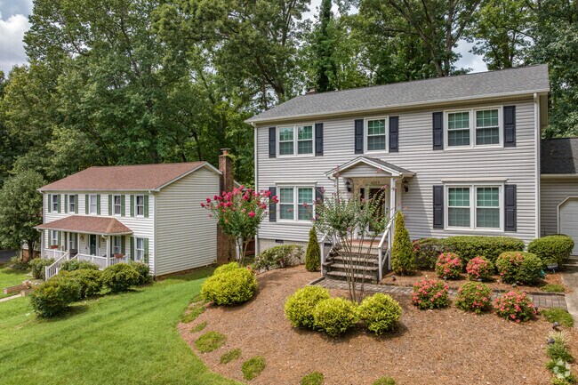 Colonial-style homes in The Thicket have well-manicured lawns.