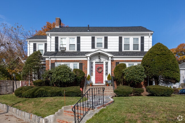 This Colonial in West Codman Hill-West Lowe boasts a brick facade.