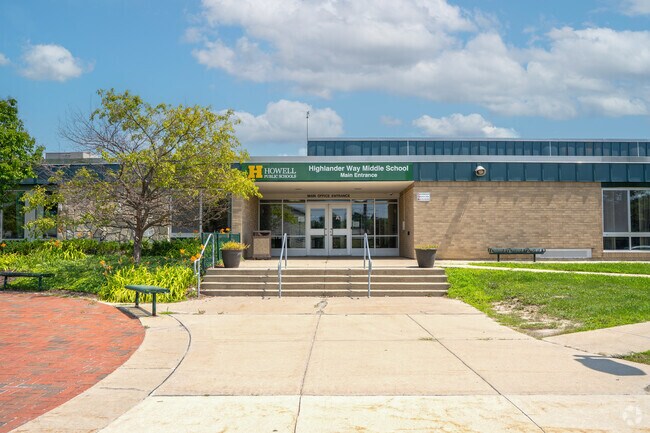 Highlander Way Middle School has a seating area by the front entrance of the school.