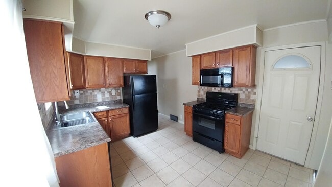 Kitchen (includes fridge, stove, and microwave)