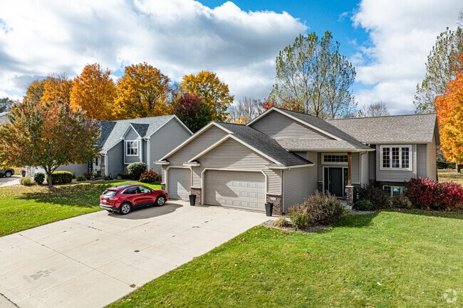 New traditional builds in Pine Island show Craftsman and colonial touches on manicured lots.