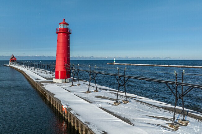 Grand Haven State Park is home to an iconic red lighthouse and miles of sandy shoreline.
