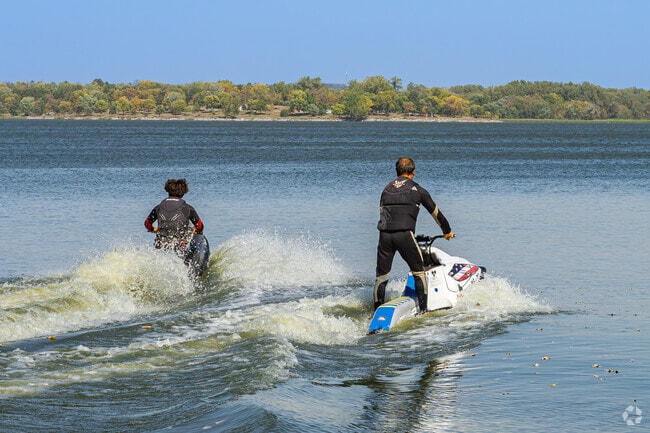 Two Oak Hills friends enjoy riding their jet skis on the lake at Pawnee State Recreation Area.
