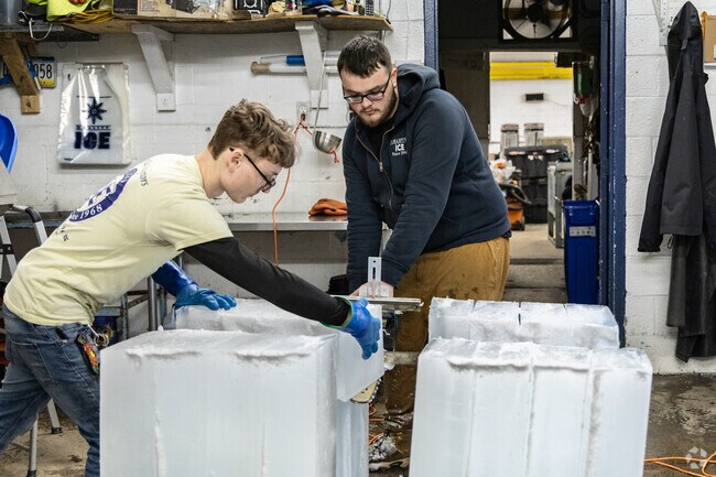 Staff working together preparing ice for sculpture making at DiMartino Ice Company in Jeannette.