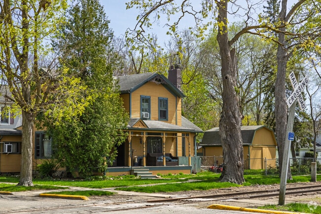 Victorian homes in Clinton often peer out from between tall oak trees shading their front lawns.